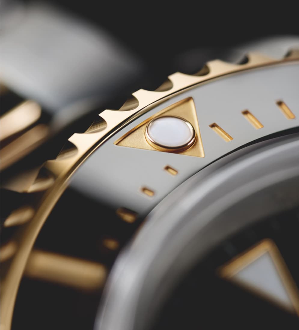 Closeup of Rolex Sea-Dweller Oyster highlighting luminescent dial